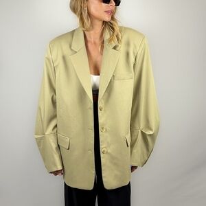 Sand color beige oversized blazer with wide sleeve. Woman blazer, suit jacket.